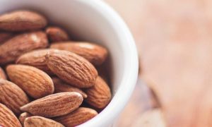 healthy almond nut in small white bowl