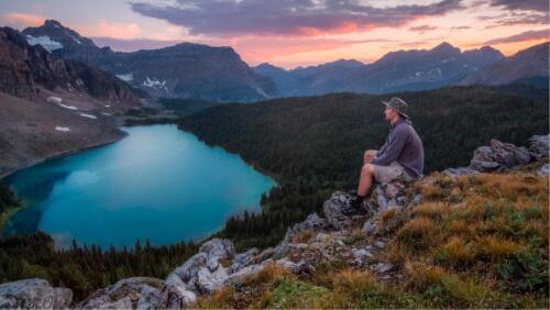 Man Sitting on Mountain