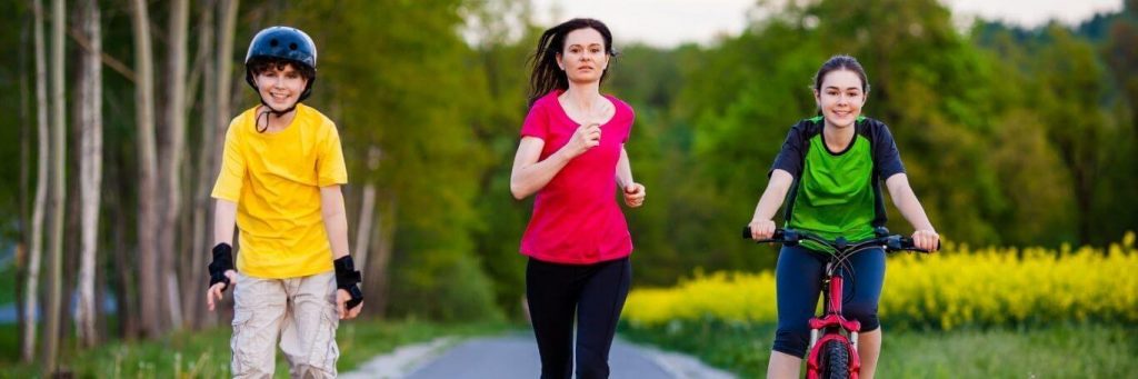 woman daughter son exercise jogging riding bike skating in park