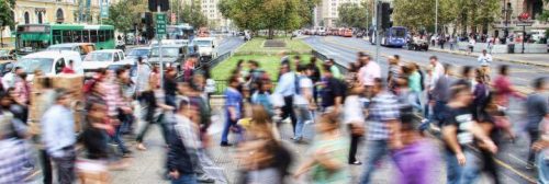 crowded busy street vibrant city people crossing roads