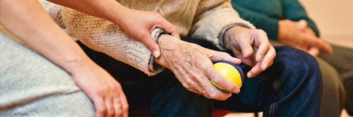 hand holding elderly arm