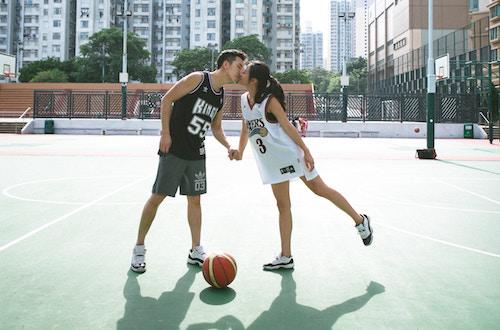 couple playing basketball together