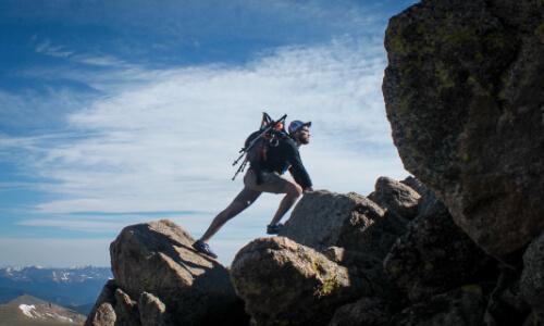 Man Climbing Mountain