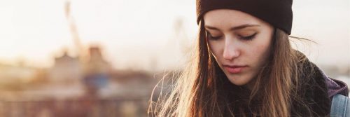 woman look downward worrying