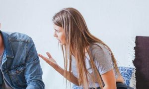 couple having conflict arguing in living room