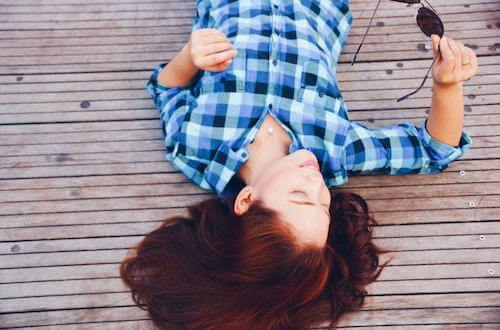 Woman laying on a deck