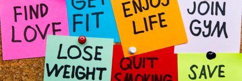 colorful sticky notes detailing healthy lifestyle phrases find love get fit enjoy life join gym quit smoking lose weight