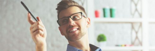 man undercut hairstyle carries pen pointing