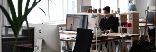 man sits in office working