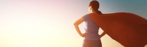 woman standing looking at sunny sky