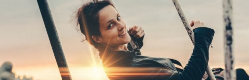 woman happily smiling shining sun