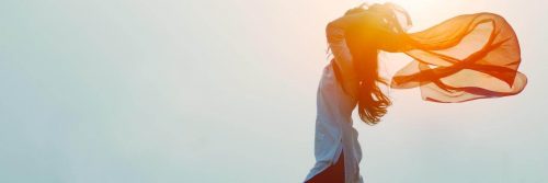 woman stands gratitude life in sunny sky