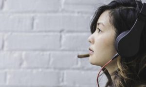 woman wearing headphone talking