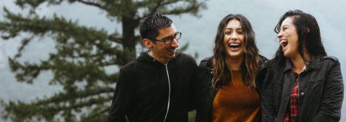 group of old closed friends happily reconnects talking laughing