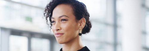 short black hair woman happy face smiles in office room