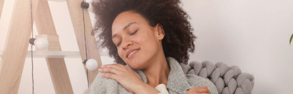 Self love, beautiful woman in grey cardigan