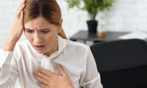 Woman having Panic attack in workplace