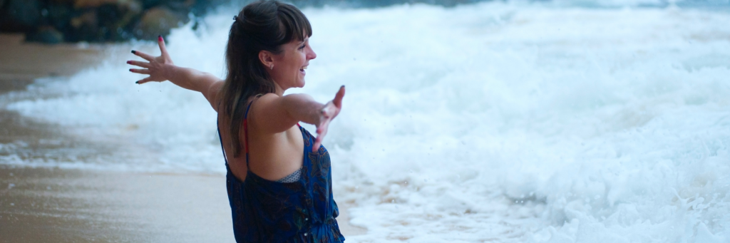 woman happily stands on beach gratitude life showing unconditional love to nature