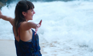 woman happily stands on beach gratitude life showing unconditional love to nature