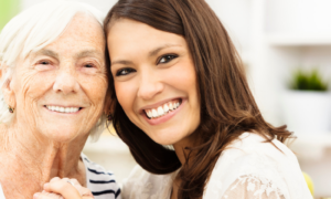 grandmother granddaughter happy faces smiling posing for photos in living room