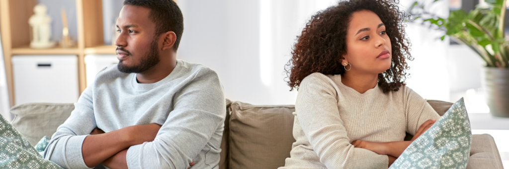 relationship difficulties, conflict and people concept - unhappy african american couple having argument at home