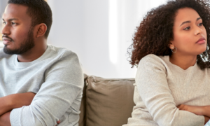 relationship difficulties, conflict and people concept - unhappy african american couple having argument at home