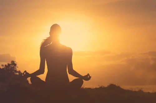 Woman Meditating in the Golden Light